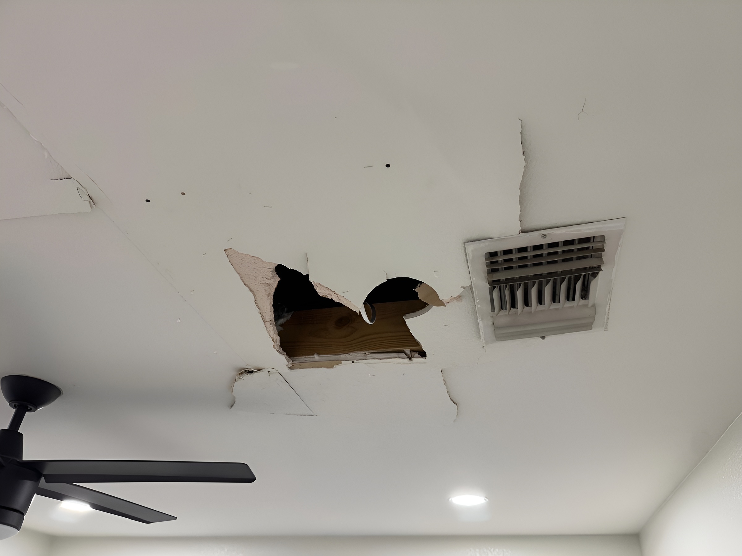 Ceiling damage before repair